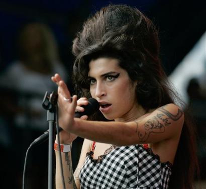 amywinehooosen Amy Winehouse cant get to the Grammy Awards... but wins everything anyway